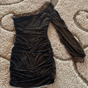 Sparkly gold one-shoulder dress.